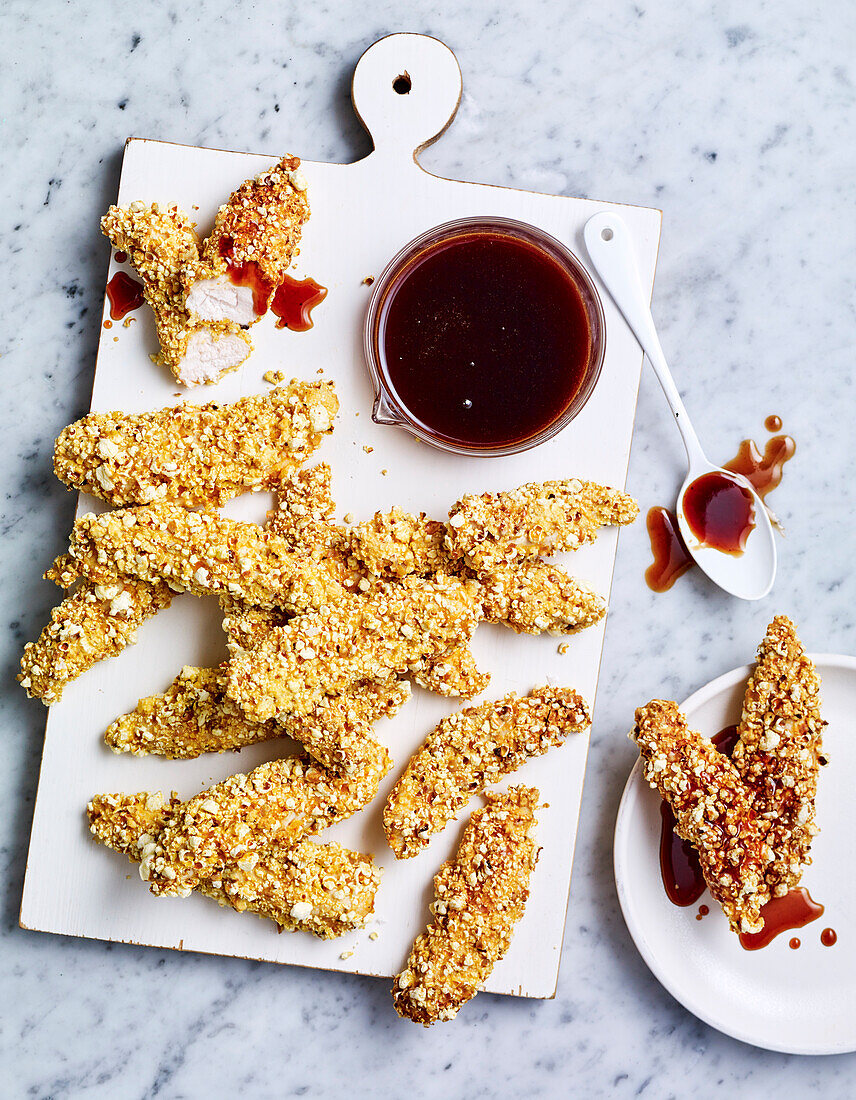 Popcorn coated chicken with honey BBQ sauce