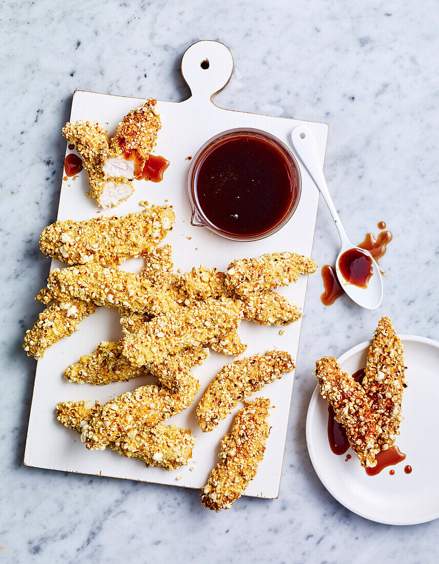 Popcorn coated chicken with honey BBQ sauce
