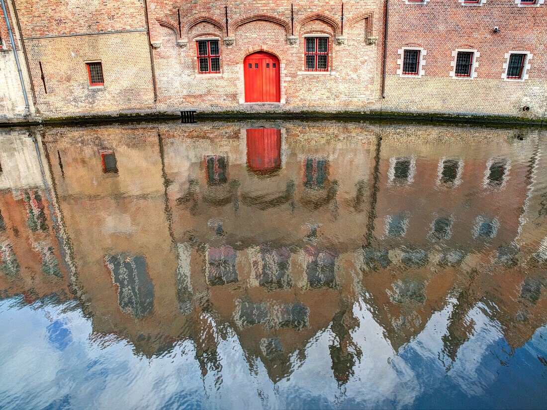 Belgium, Bruges. Reflections of medieval buildings along canal.