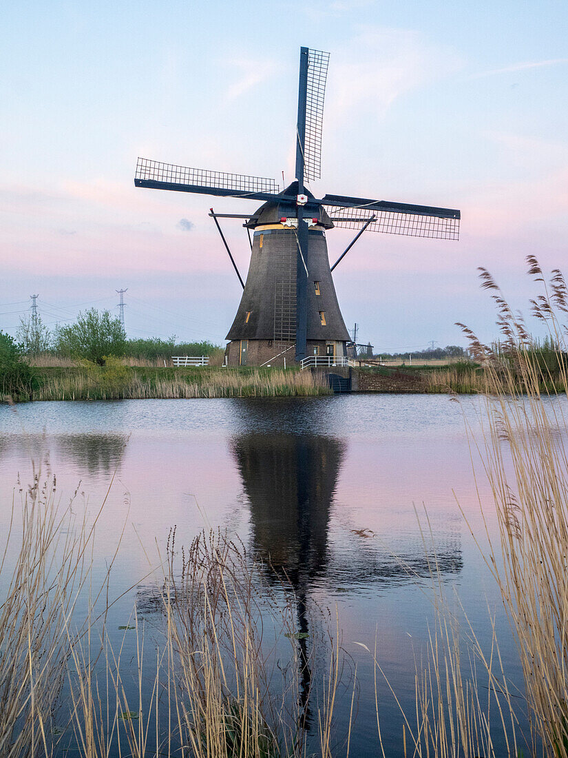 Netherland, Kinderdijk. Windmills along the canal.