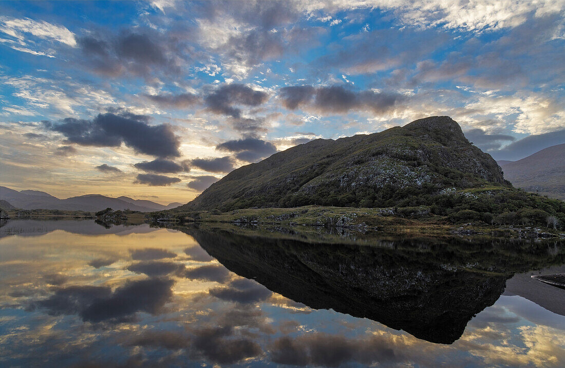 Sunset clouds reflect in Upper Lake Killarney in Killarney National Park, Ireland