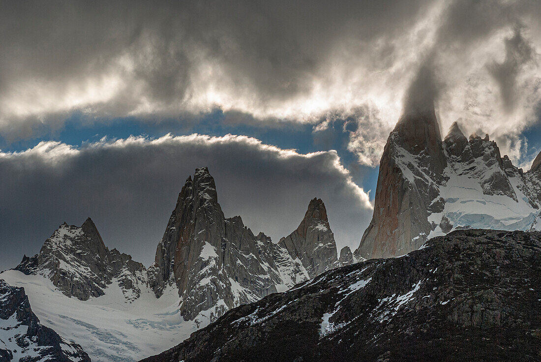 Argentina, clouds move across Cerro Poincenot and ridgeline, Los Glaciares National Park, Patagonia.