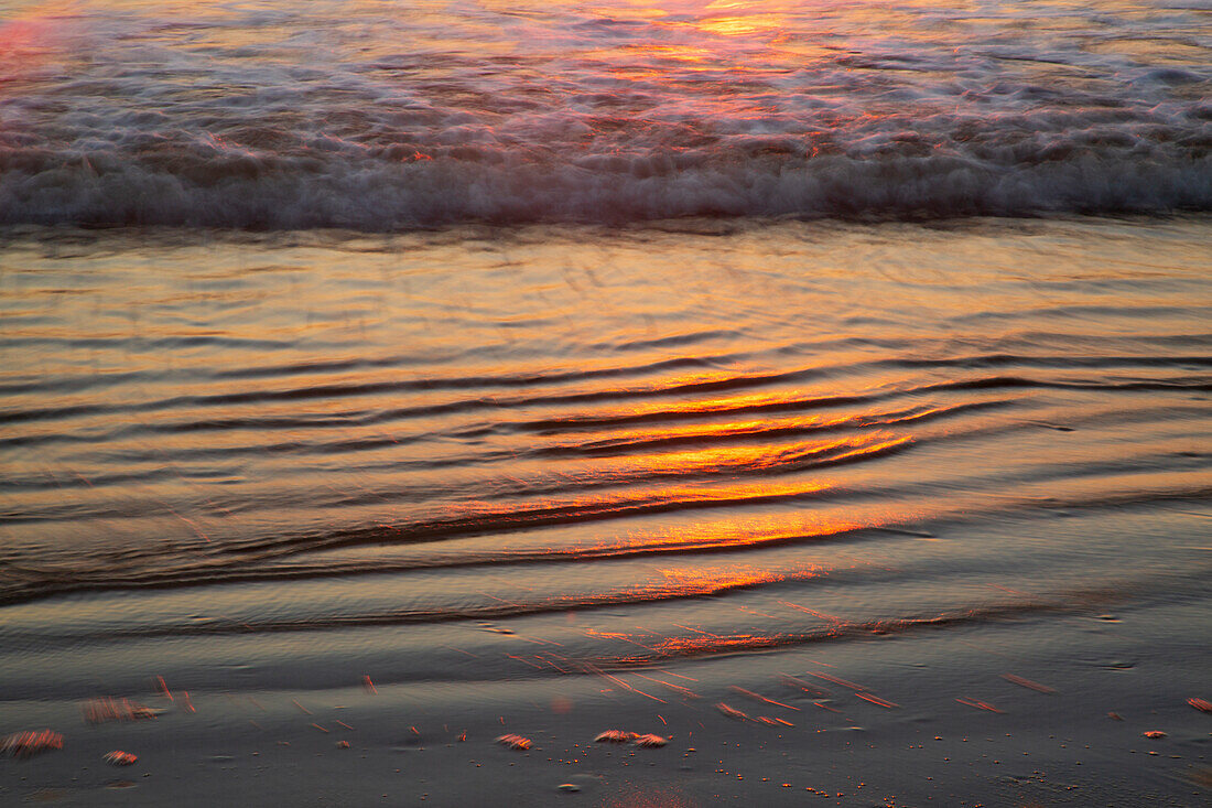 USA, Georgia, Tybee Island. Sunrise with ripples in the sand