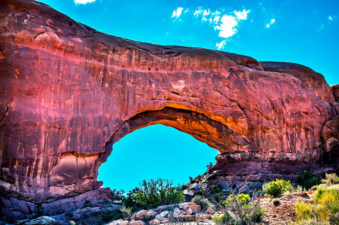 North window Arch Windows Section Arches National Park, Moab, Utah, USA. Red canyon walls and blue skies.