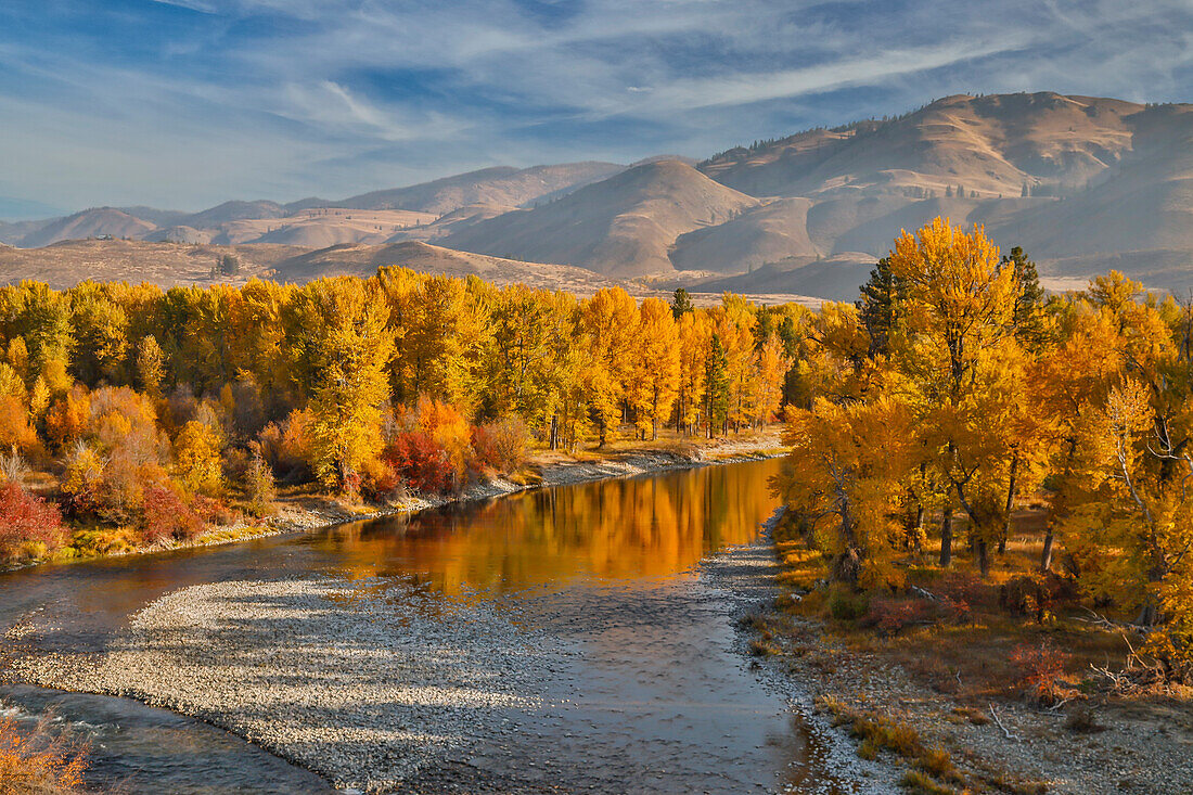 USA, Washington State, Methow Valley and river edged in Fall colored trees.