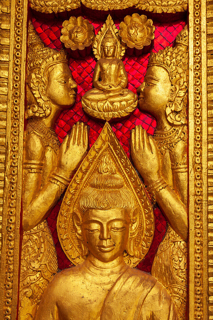 Laos, Luang Prabang. Haw Pha Bang, royal temple on the grounds of the Royal Palace Museum. Carved panel on wall.