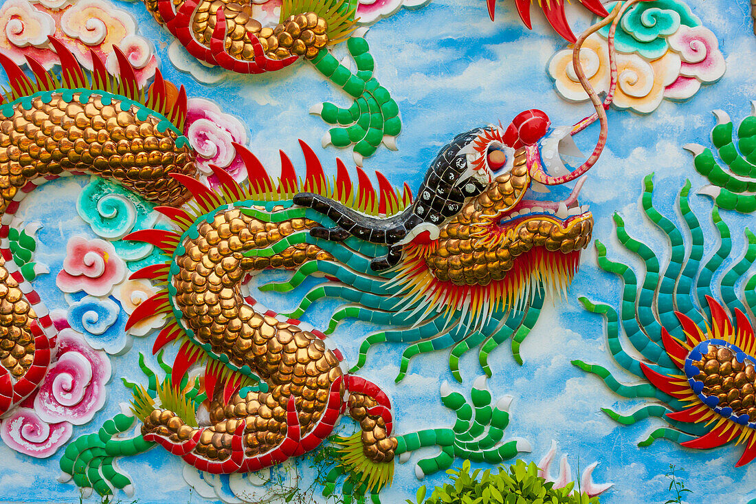 Bangkok, Thailand. Colorful relief of dragon or serpent.