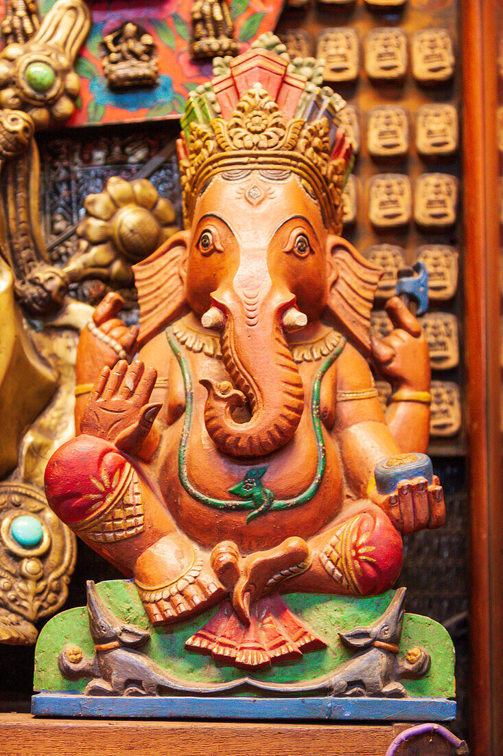 Thailand, Bangkok. Carved and painted wooden statue of Ganesha, or Phra Phikanet.