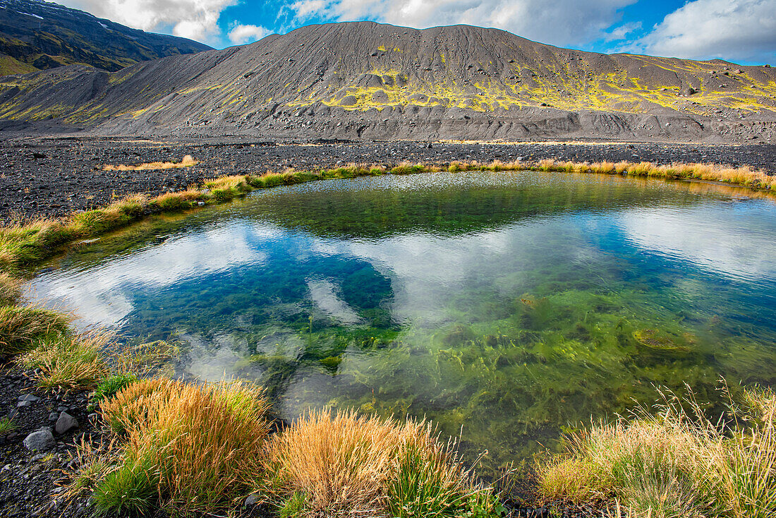 Tiny pond created by violent volcanic forces. The eruption of the Eyjafjallajokull volcano in 2010 caused much melting of the icecap that covered the volcano.