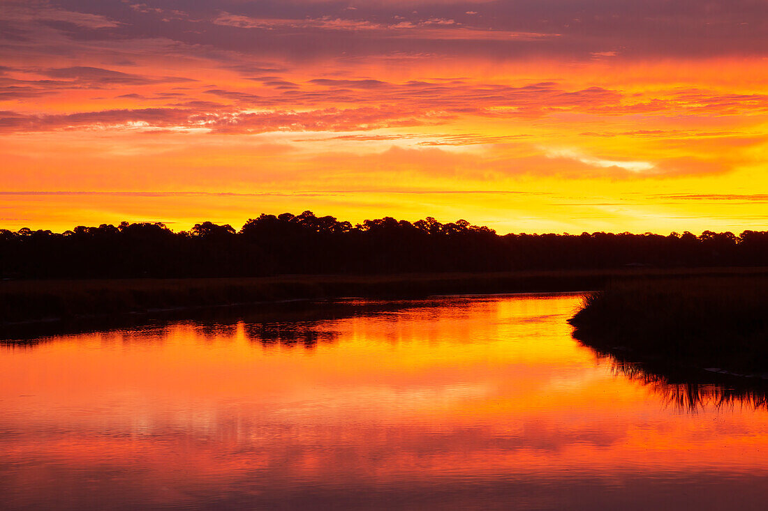 USA, Georgia, Savannah. Sunrise along Grimball Creek.