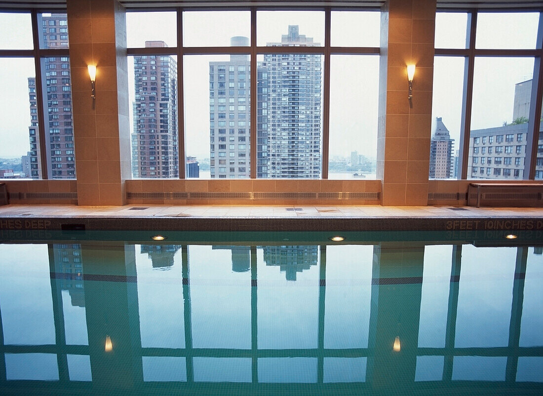 Swimming Pool With Urban City Skyline