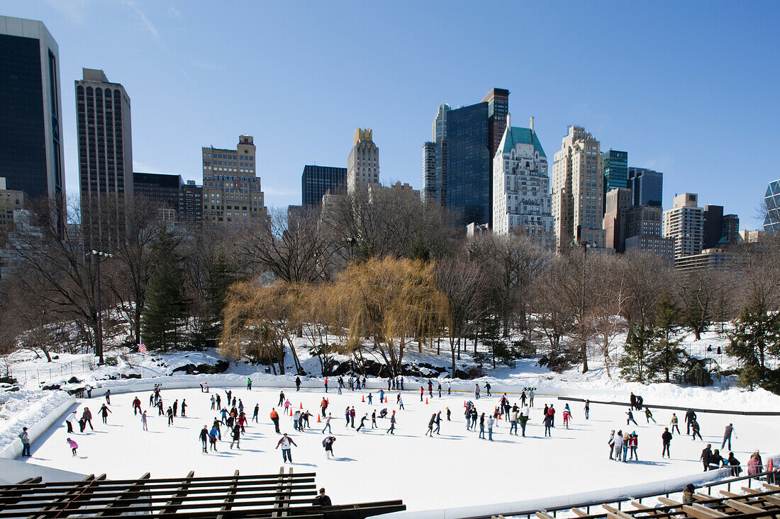USA, Tilt Shift Image of Skaters on Pond at Southern End of Central Park; New York City