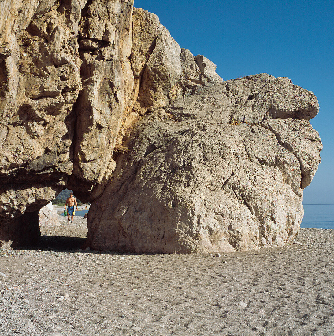 Olympos Beach, Male Tourist Under Rock Bridge