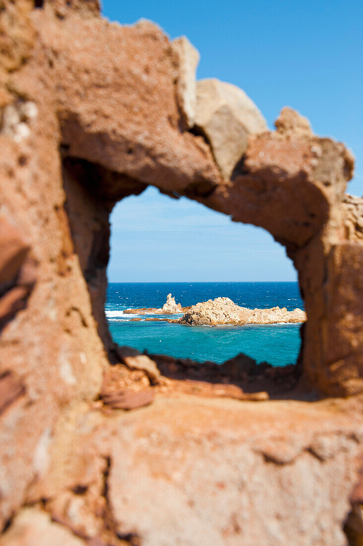 Cala Pregonda As Seen Through The Rocks, Menorca, Balearic Islands, Spain