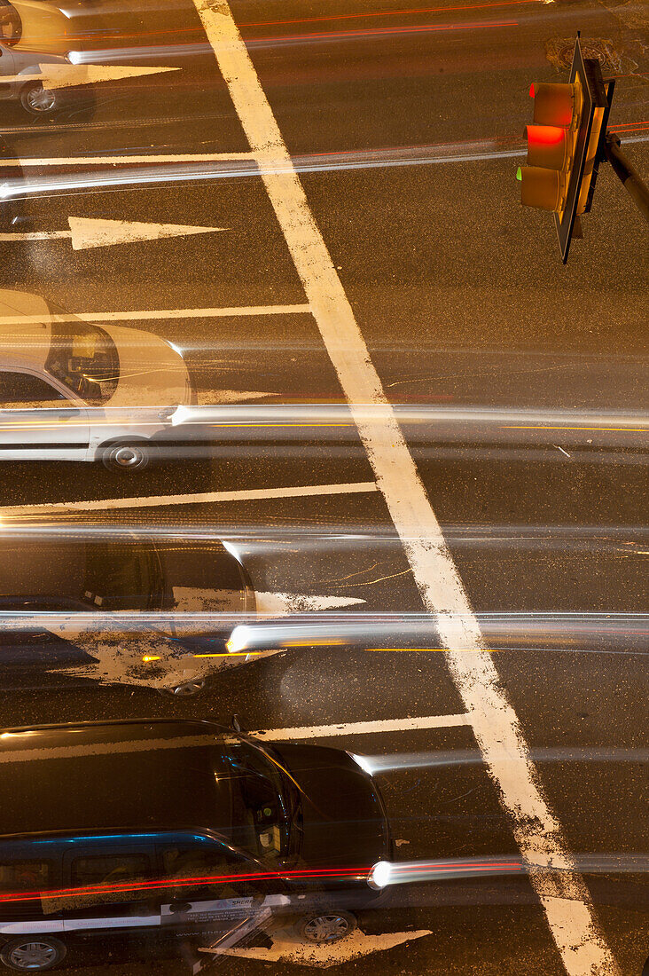 The blur of headlights and taillights from vehicles on a road; Casablanca, Morocco