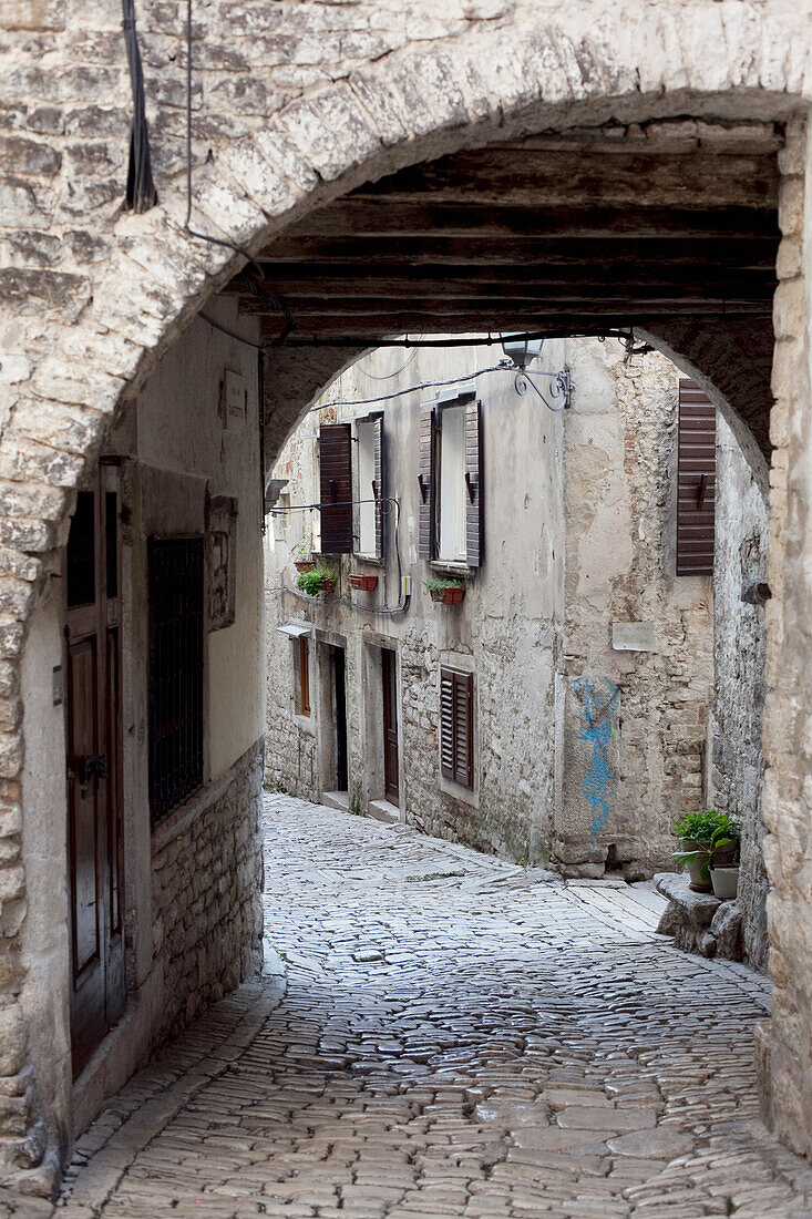 Old buildings and alley in old town Rovinj; Rovinj, Istria, Croatia