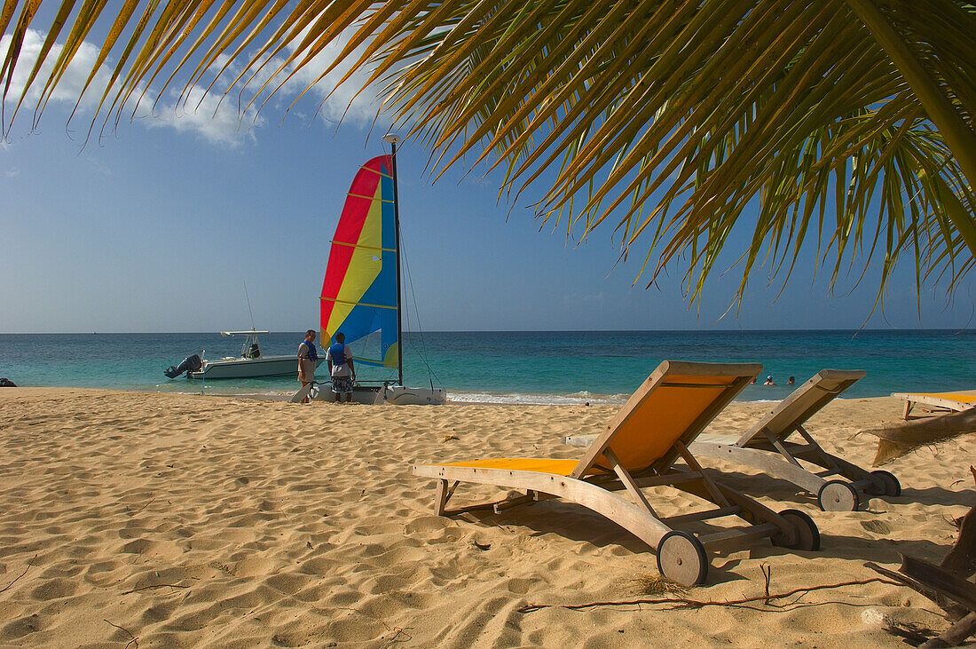 Sailboat And Deck Chairs On The Sands Of Magazine Beach; Carriacou Island, Grenada