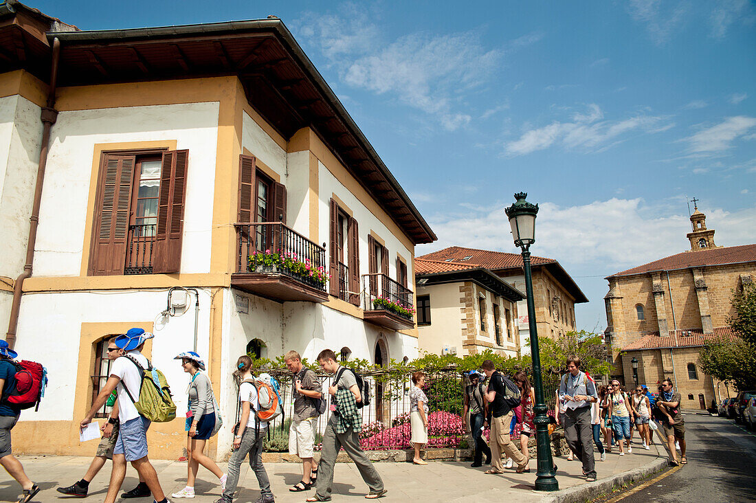 Backpackers Passing In Front Of Euskal Herria Museum, Gernika-Lumo, Basque Country, Spain