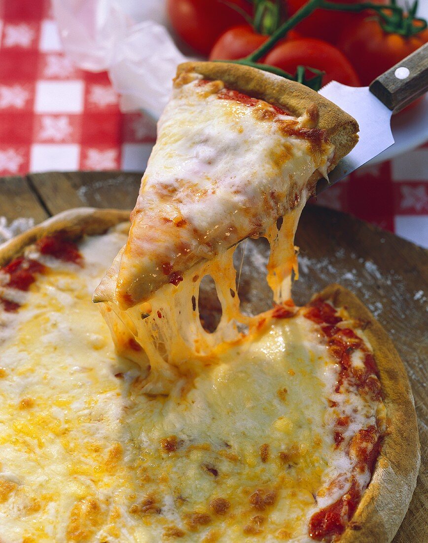 Pizza Margherita (cheese & tomato pizza), a piece on server