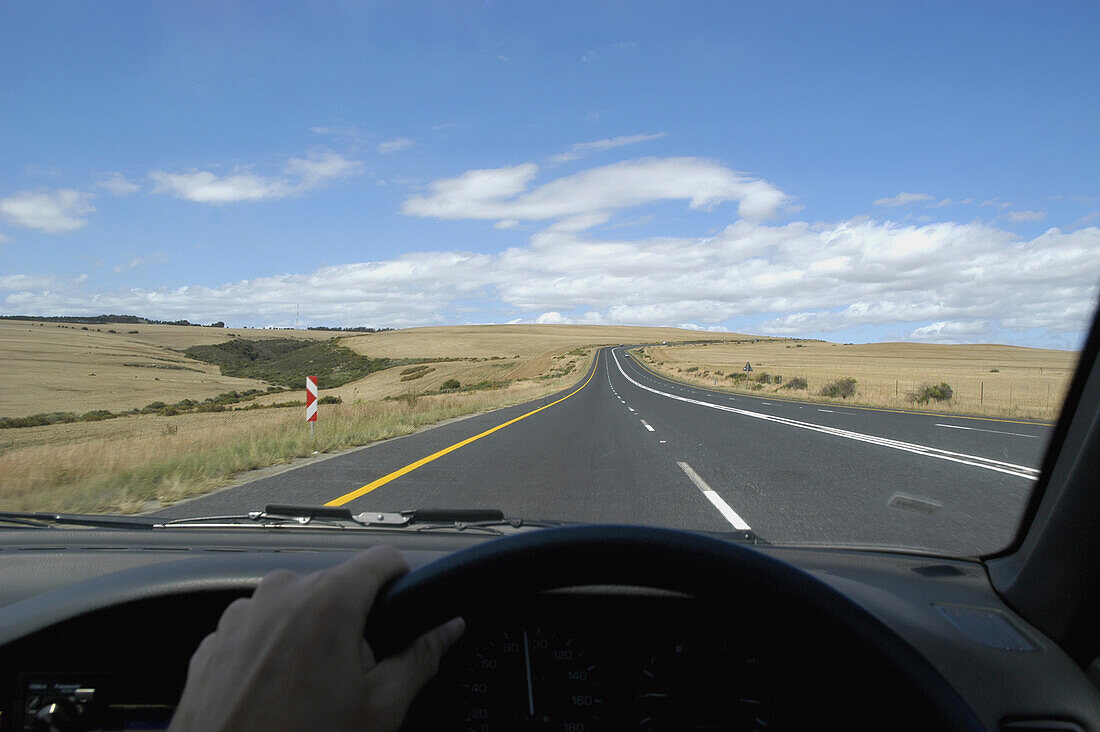 Driving Along Empty Roads Through Rolling Hills Of South Africa Between Cape Town And The Garden Route.