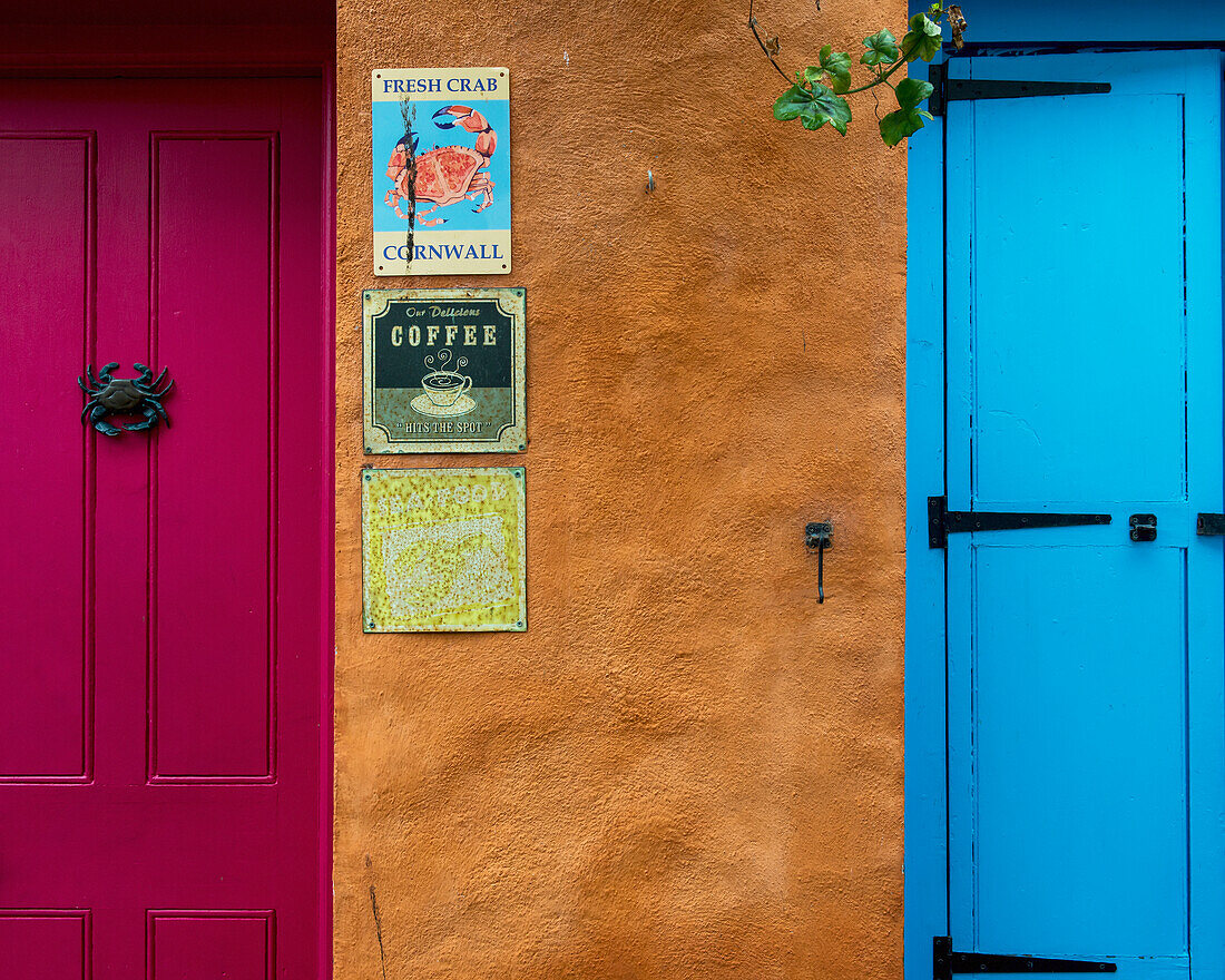 United Kingdom, England, Cornwall, Colorful shop front doors and signs; Falmouth