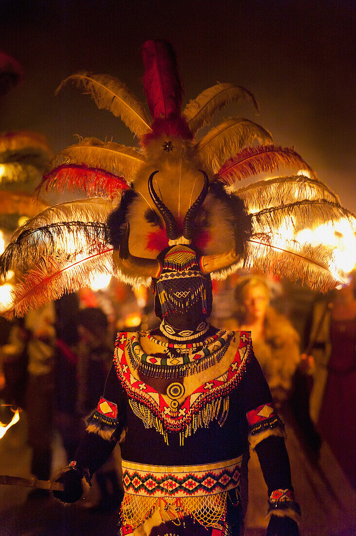 Man Dressed As Zulu Warrior In March At The East Hoathly Bonfire Night, East Sussex, Uk