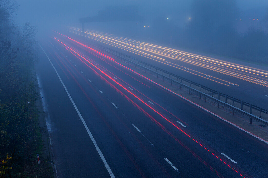 View of highway on foggy morning; United Kingdom