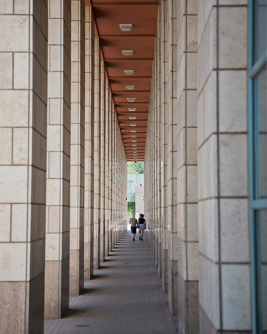 USA, Colorado, Middle aged couple walking near Denver Art Museum; Denver