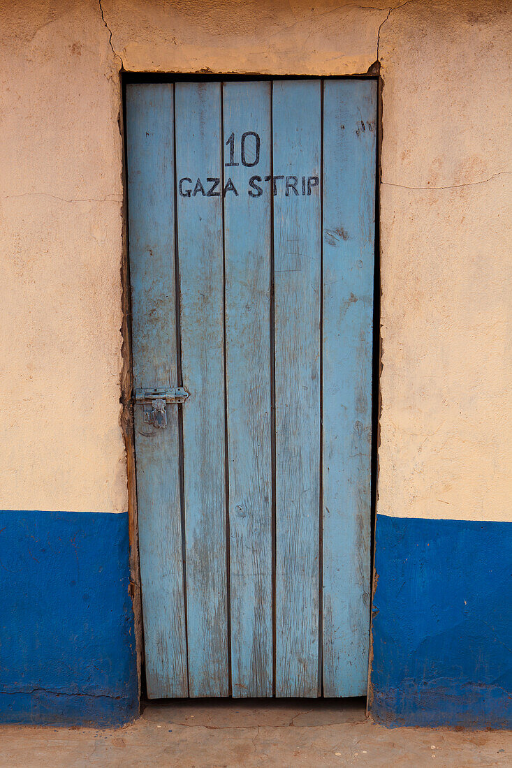 Door of room in cheap hotel; Kenya