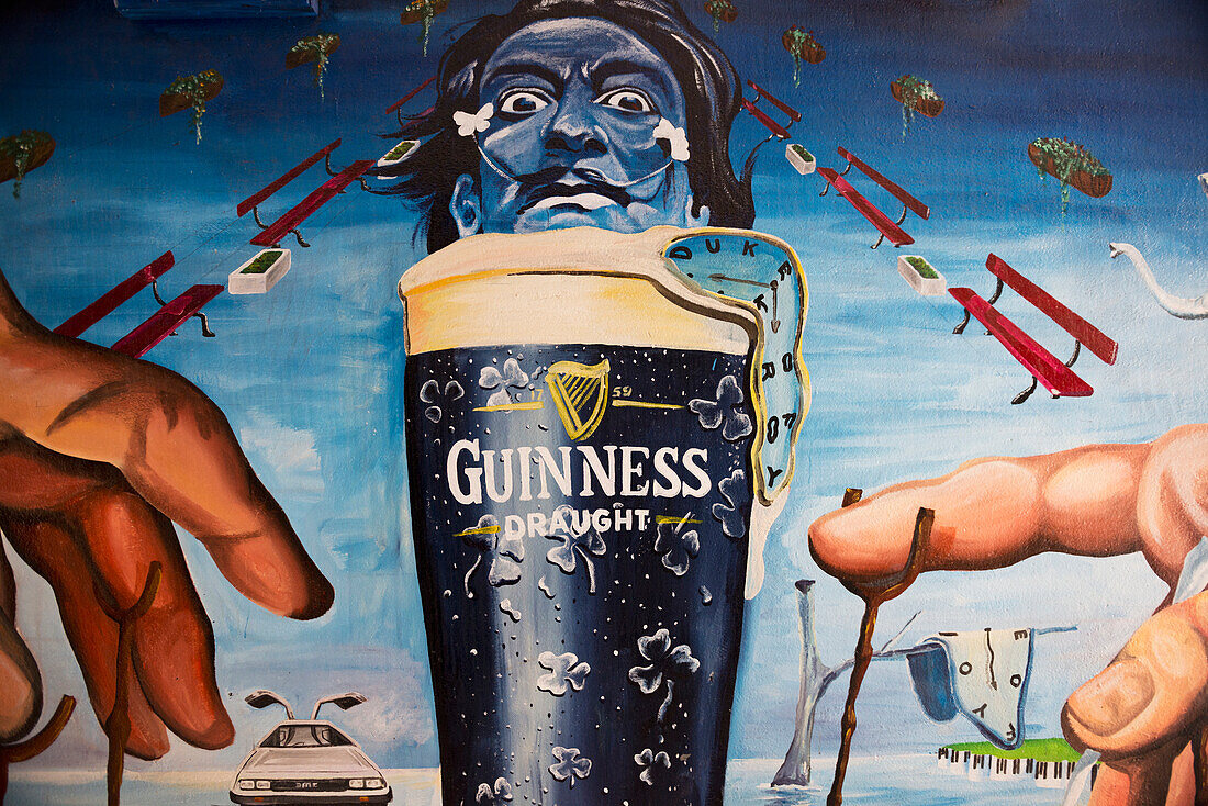United Kingdom, Northern Ireland, Dali style mural of pint of Guinness; Belfast