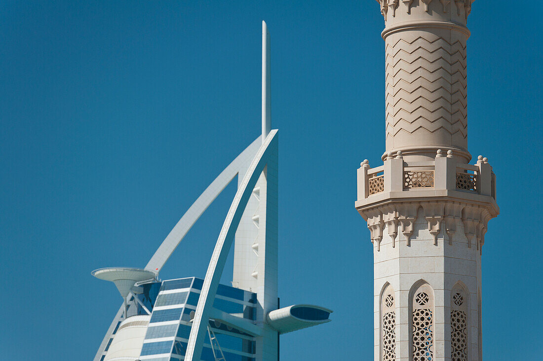 UAE, Detail of minaret of small mosque in front of Burj Al Arab hotel; Dubai