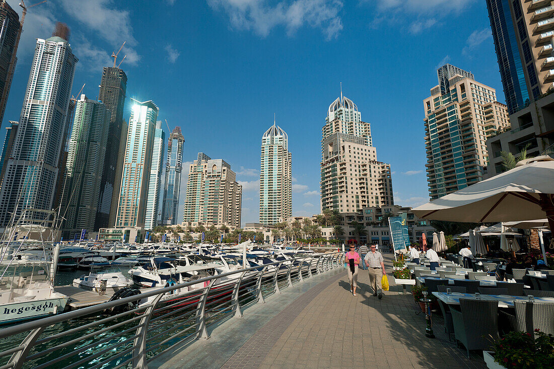 UAE, Boats and cafes in the Dubai Marina; Dubai