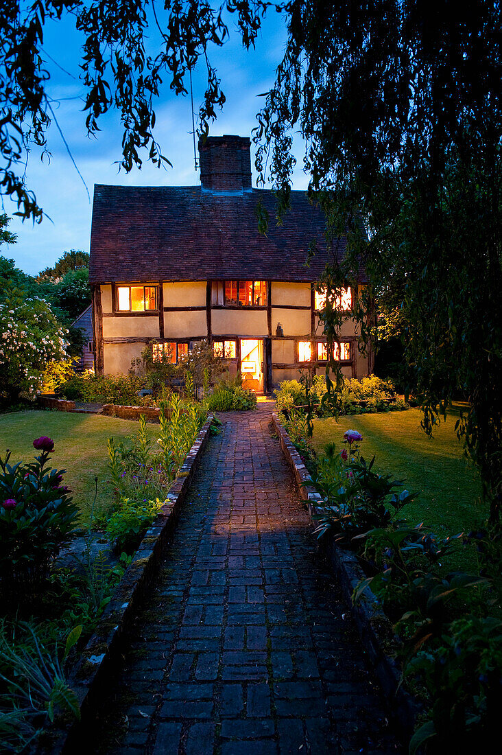 UK, Kent, Old cottage at dusk; Cranbrook
