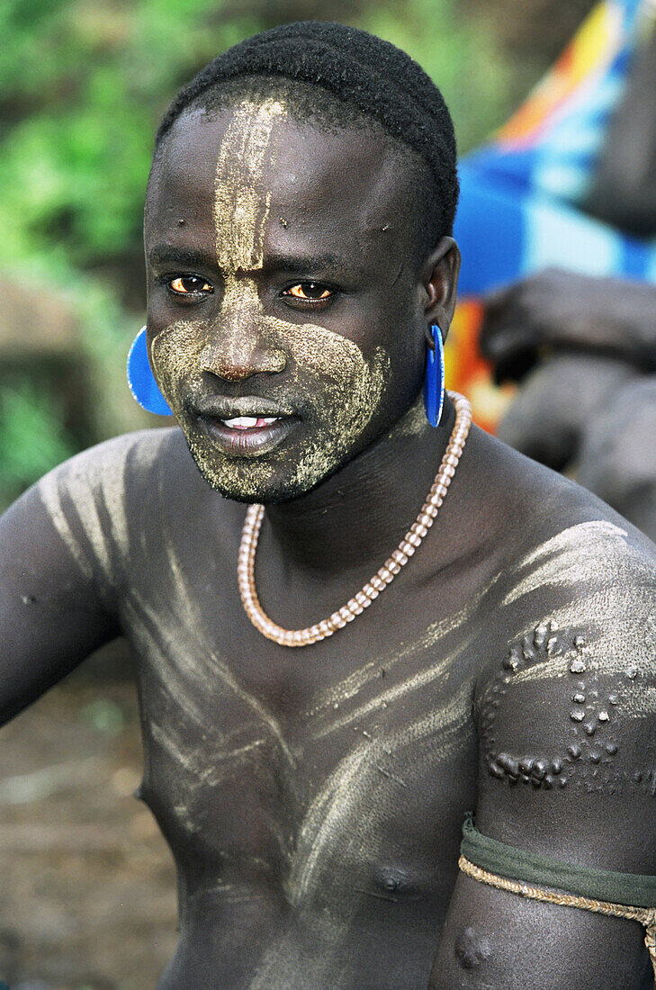 Portrait of Mursi tribal man. Makki / South Omo / Southern Nations, Nationalities & People's Region (Ethiopia).