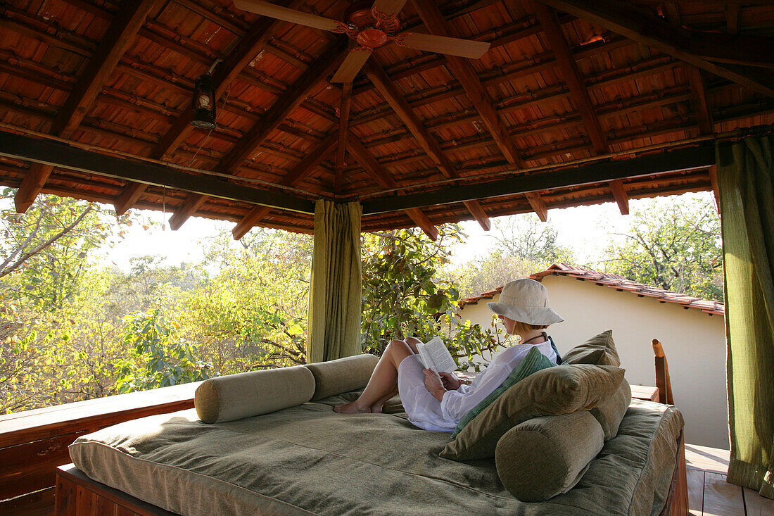Relaxed And Reading At Baghvan Wilderness Lodge, Pench National Park; Madhya Pradesh, India