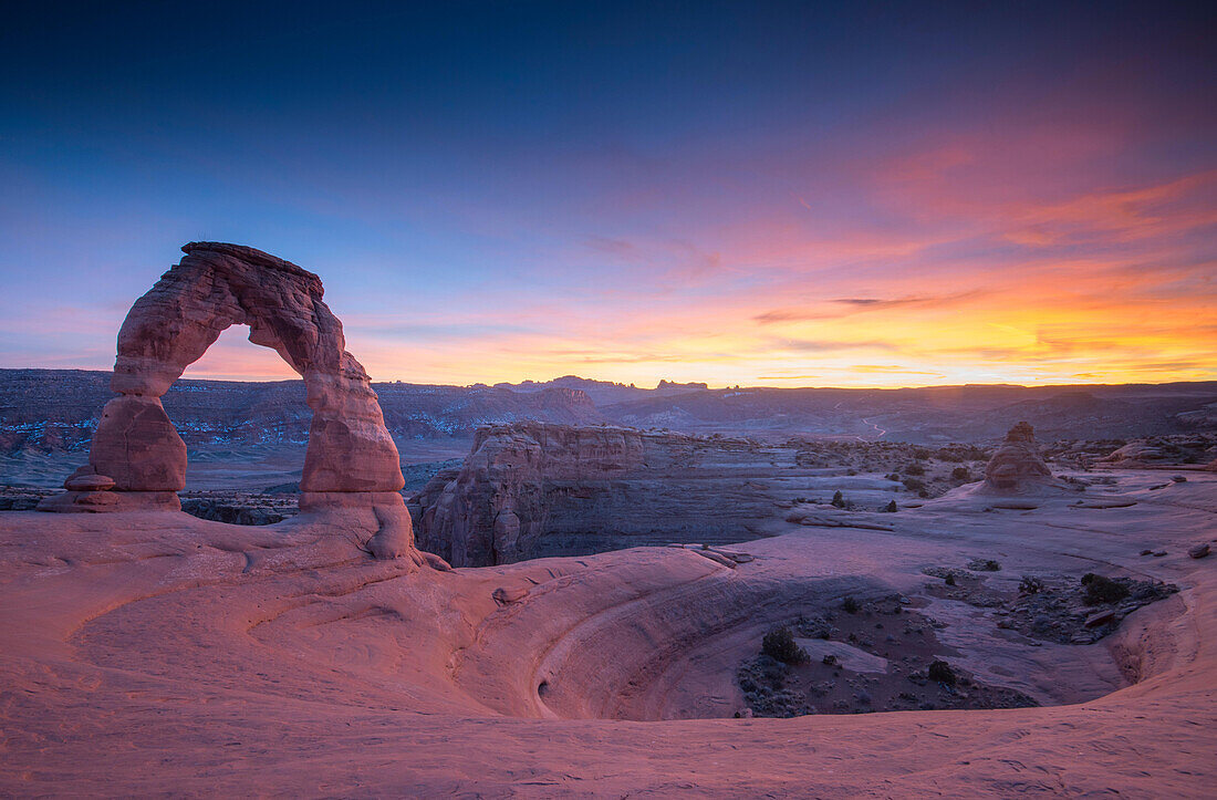 Sunset at Delicate Arch, located in Arches National Park, Utah.