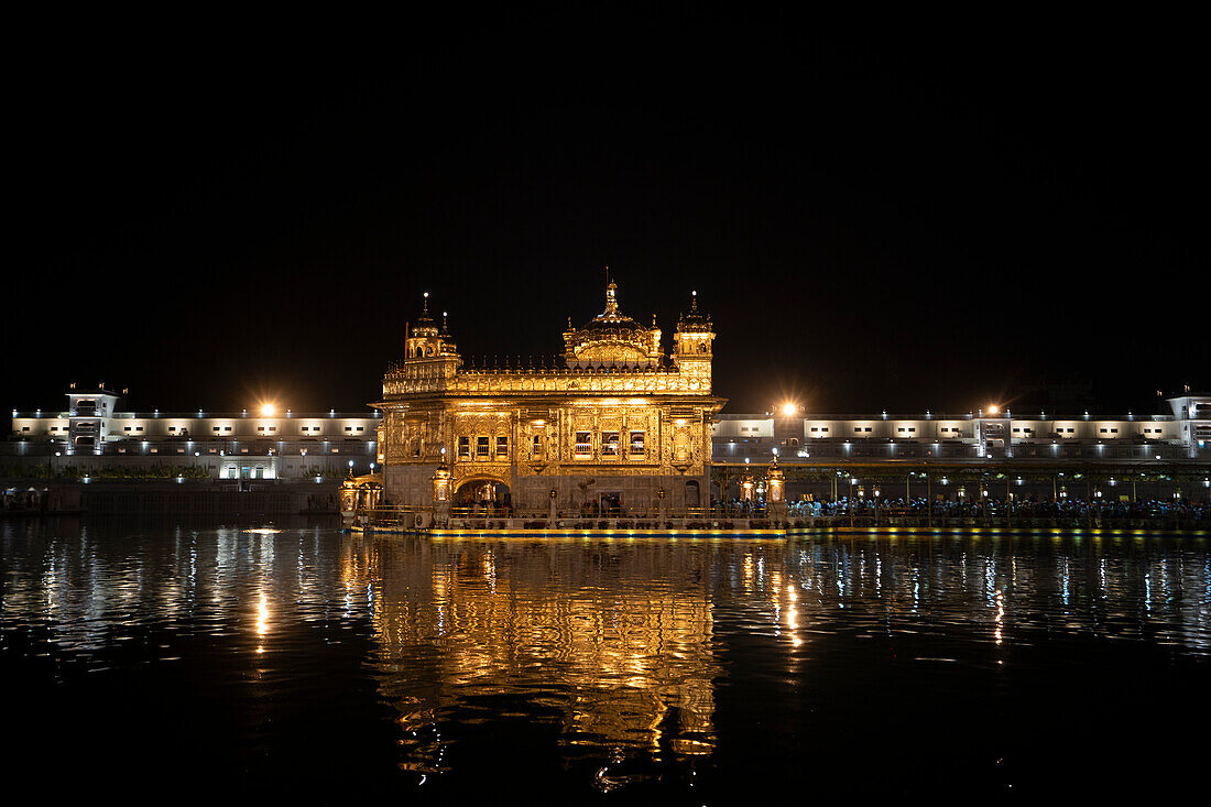 The Golden Temple (Sri Harmandir Sahib) Gurdwara and Sarovar (Pool of Nectar), at dusk; Amritsar, Punjab, India