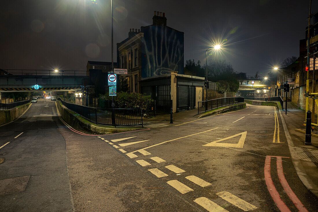 Fork in the road, empty night streets around Haggerston; London, England