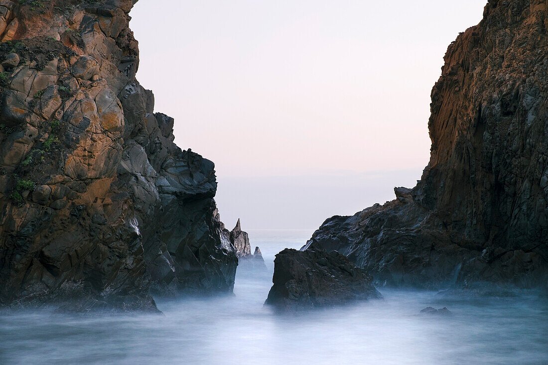 Jagged cliffs and rock formations along the coast at Pfeiffer Beach in Los Padres National Forest in Big Sur; California, United States of America
