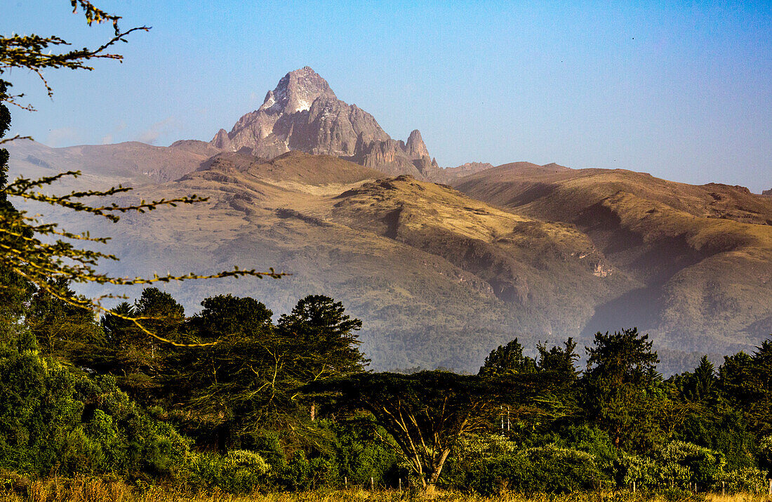 Dramatic view of Mount Keynya with the mist rising from forest below in Nyeri County, near Nanyuki; Kenya, Africa