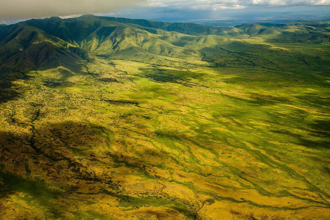 Aerial of mountains and farmland near Lake Manyara, Tanzania.
