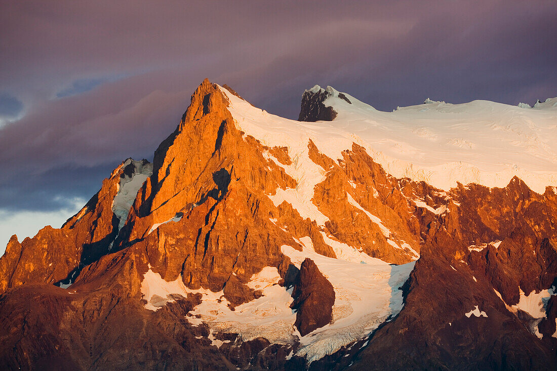Detail of snow-covered mountain peaks of the Torres del Paine mountains at sunrise, Torres del Paine National Park; Patagonia, Chile