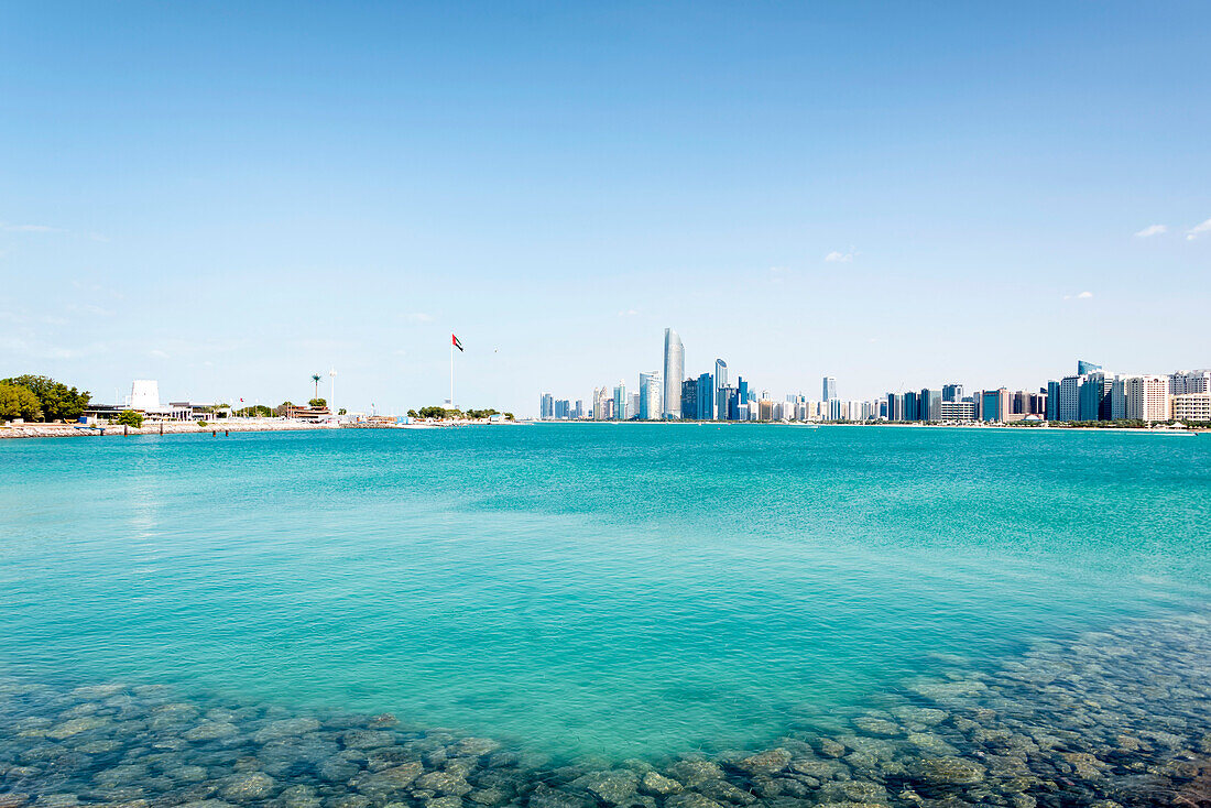 A view looking toward the skyline of Abu Dhabi City viewed from the Marina Island Roadway; Abu Dhabi, United Arab Emirates