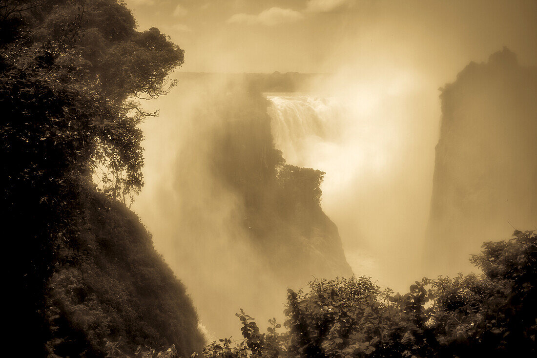 A misty landscape around a Victoria Falls.