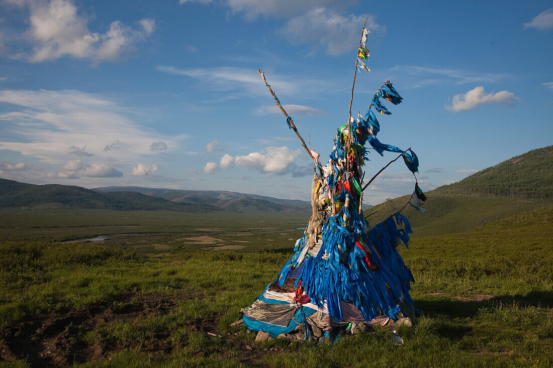 A sacred Ovuu overlooks the vast Mongolian landscape.