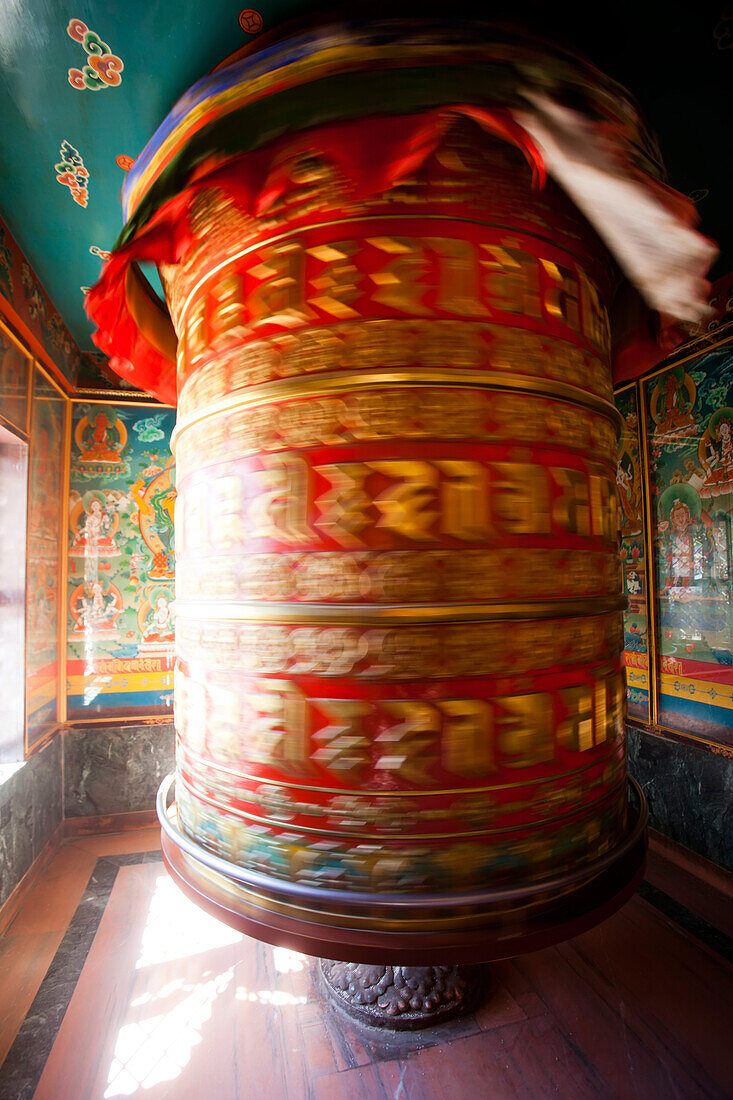 The world's largest prayer wheel spins near the Boudhanath Stupa.