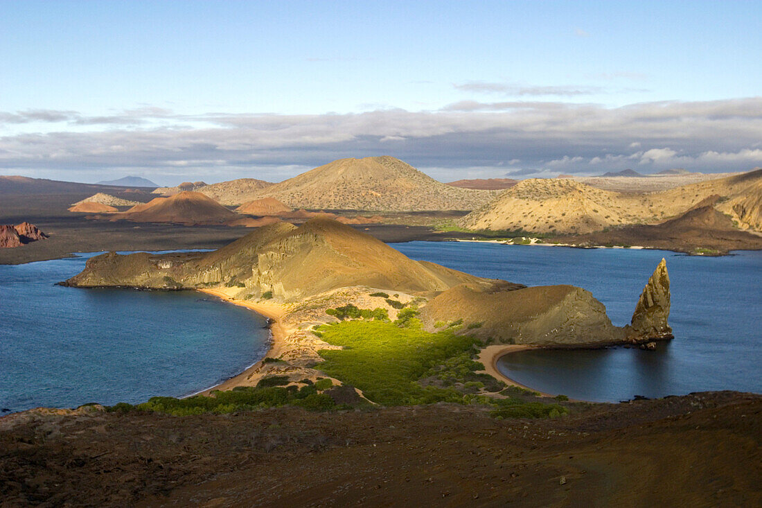 Morning light shines on the volcanic landscape of Bartolome Island.