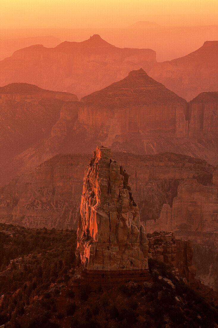 Misty sunrise over Mount Hayden, in the Grand Canyon.