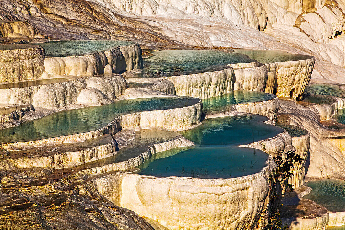 Dazzling calcium carbonate travertine pools at Pamukkale, Turkey.; The travertines at Pamukkale, western Anatolia, Turkey.