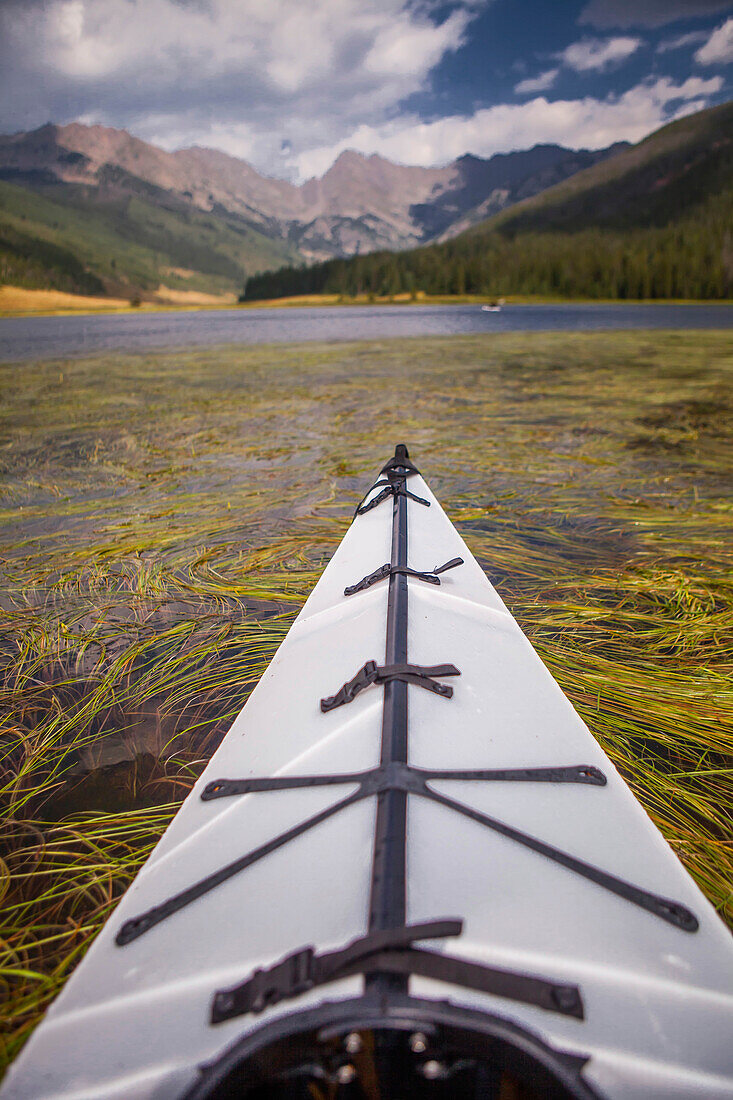 Kayaking on a mountain lake in the Gore Range.